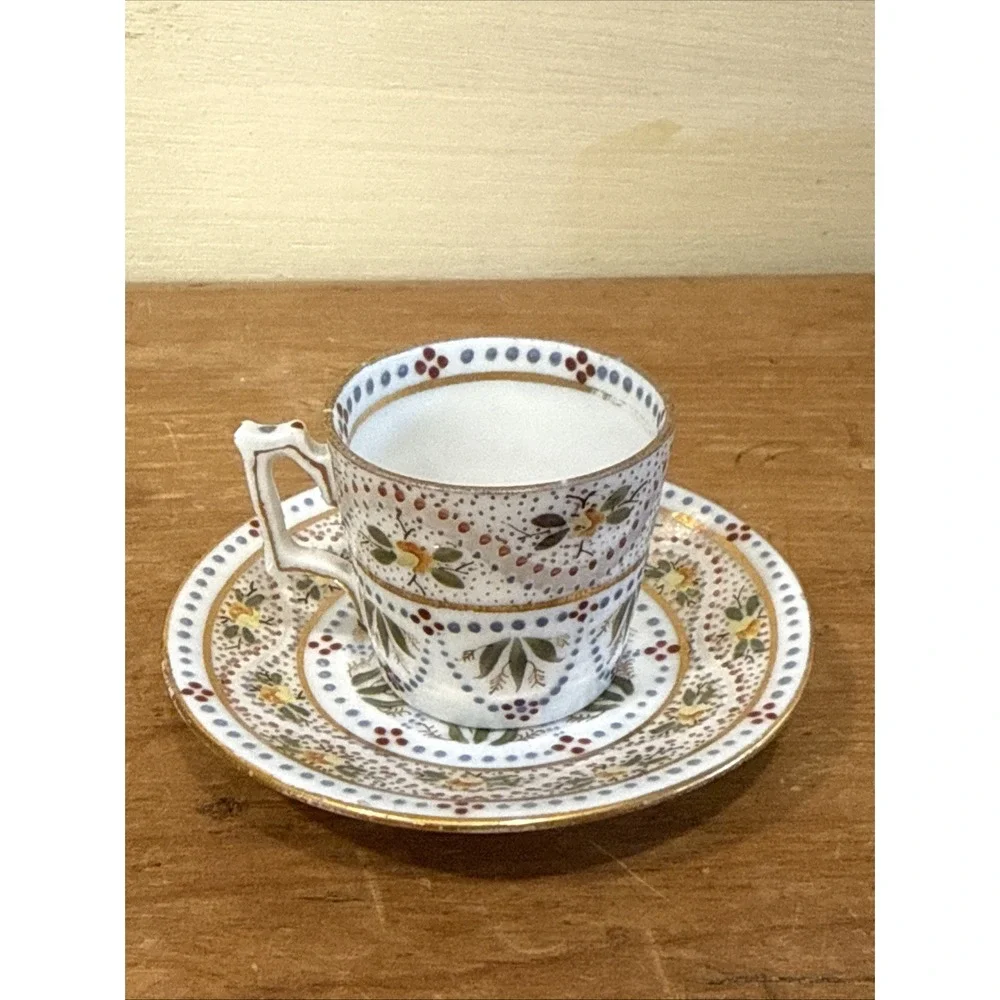 Antique Austrian demitasse cup and saucer hand painted floral gold trim